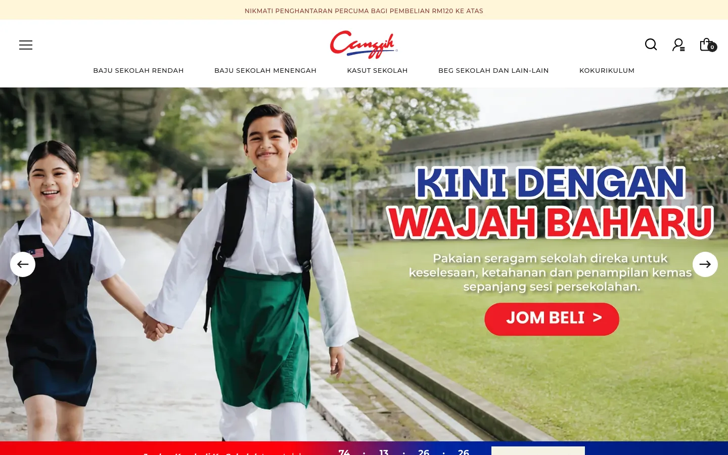 Canggih homepage on desktop: two pupils in school uniform, a "Jom Beli" button, a Malay menu for primary and secondary uniforms, shoes and bags, and a free delivery notice